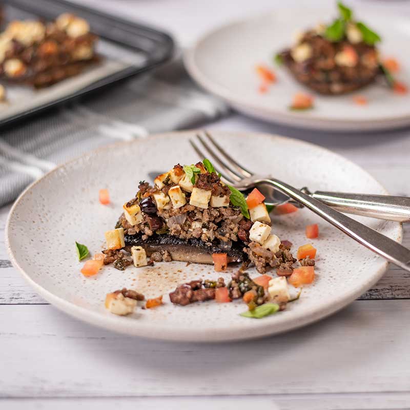 Keto Greek Stuffed Mushrooms on a plate