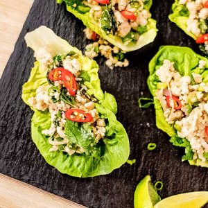 Keto Thai chicken larb salad on a black slate tray.