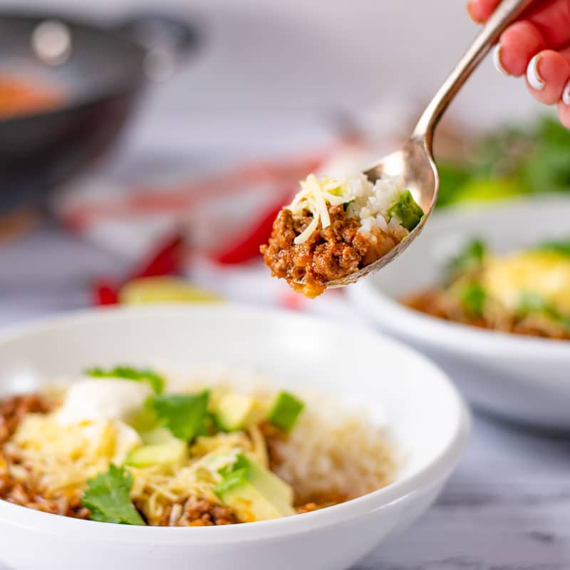 A spoonful of Keto Chili Con Carne being lifted from a bowl