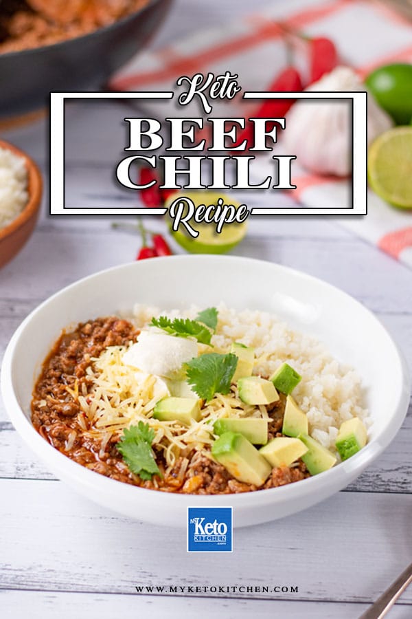 Keto Beef Chili in a bowl with cauliflower rice and topped with cheese, avocado, sour cream and cilantro