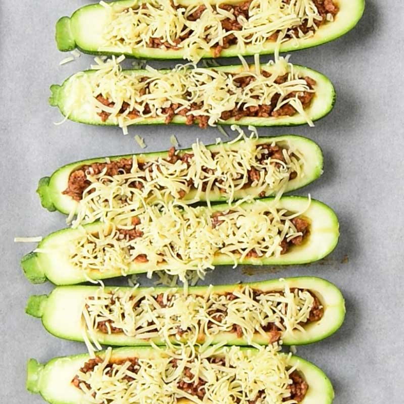 Keto Zucchini Boats Ingredients on a baking sheet