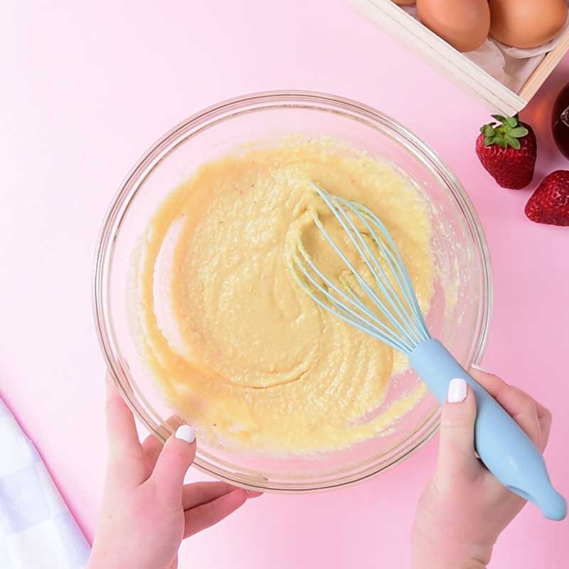 Keto Almond Flour Pancakes batter being whisked in a glass bowl