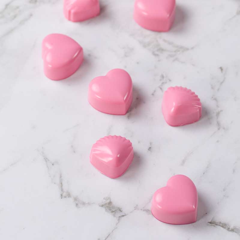 Keto Raspberry Fat Bombs on a marble table