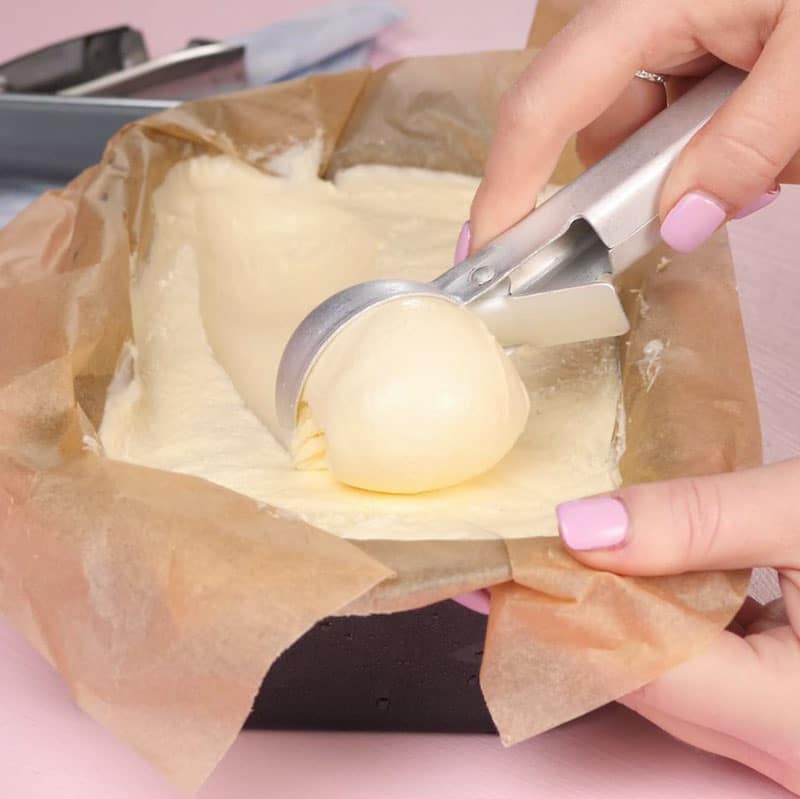 Keto Soft Serve Ice Cream being scooped from a loaf pan