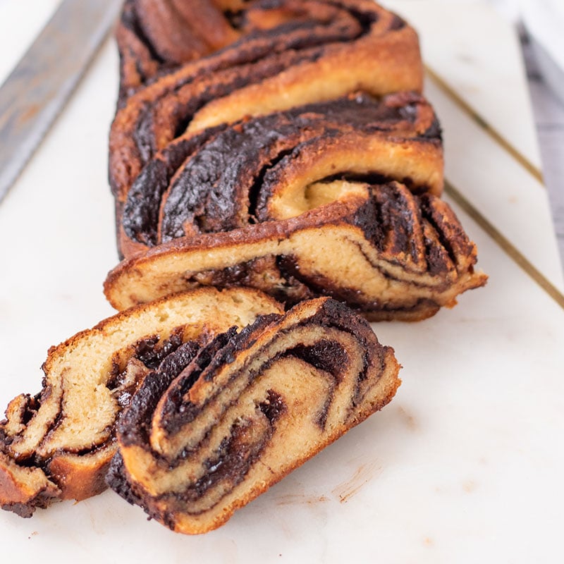 Keto Chocolate Babka with 2 slices cut off and placed to the left side