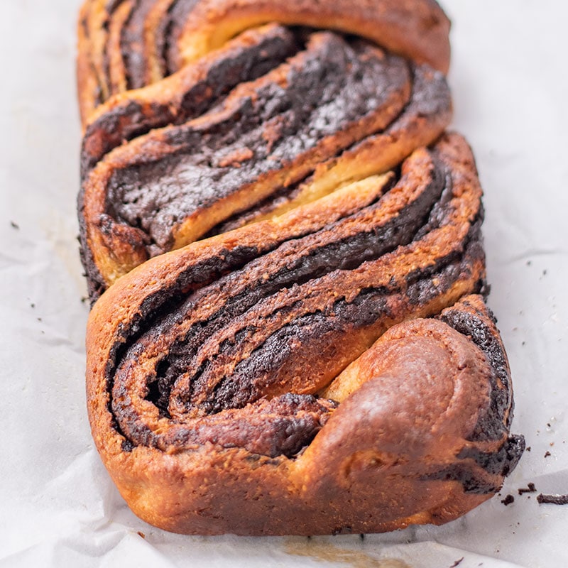 Keto Chocolate Babka Loaf on a sheet of parchment paper
