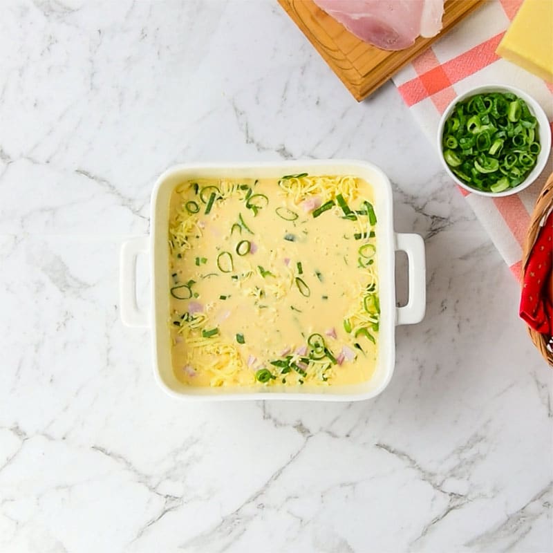 Keto Egg and Cream Cheese Bake Ingredients in a baking dish.