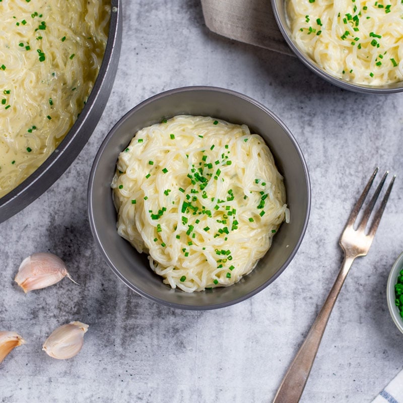 Keto Cheesy Pasta in a bowl, topped with chives.