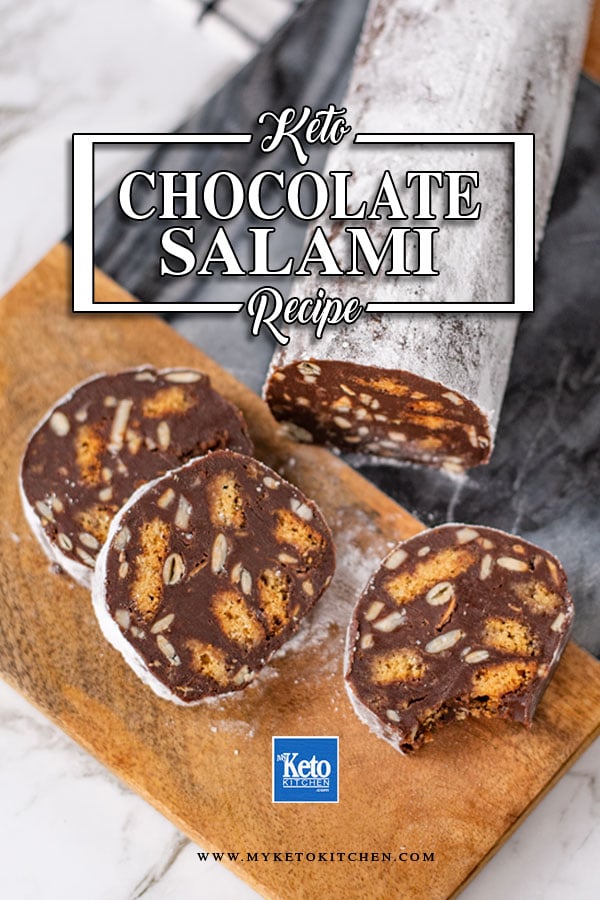 Keto Chocolate Salami sliced on a wooden and marble board