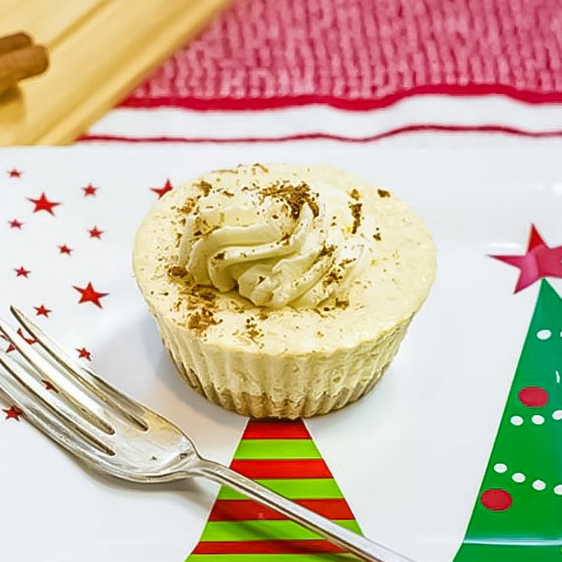 Eggnog chesecake on a christmas plate.