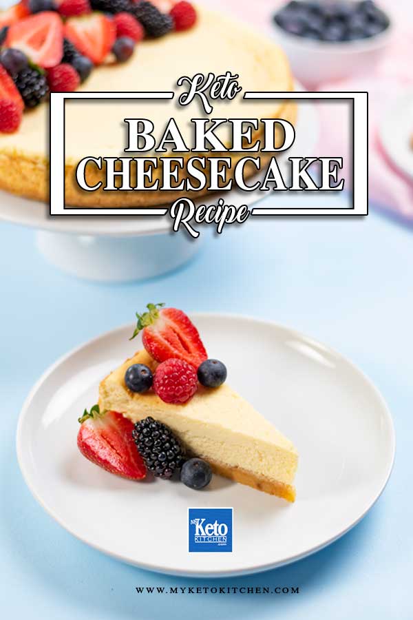 A slice of Keto Baked Vanilla Cheesecake topped with berries on a plate.