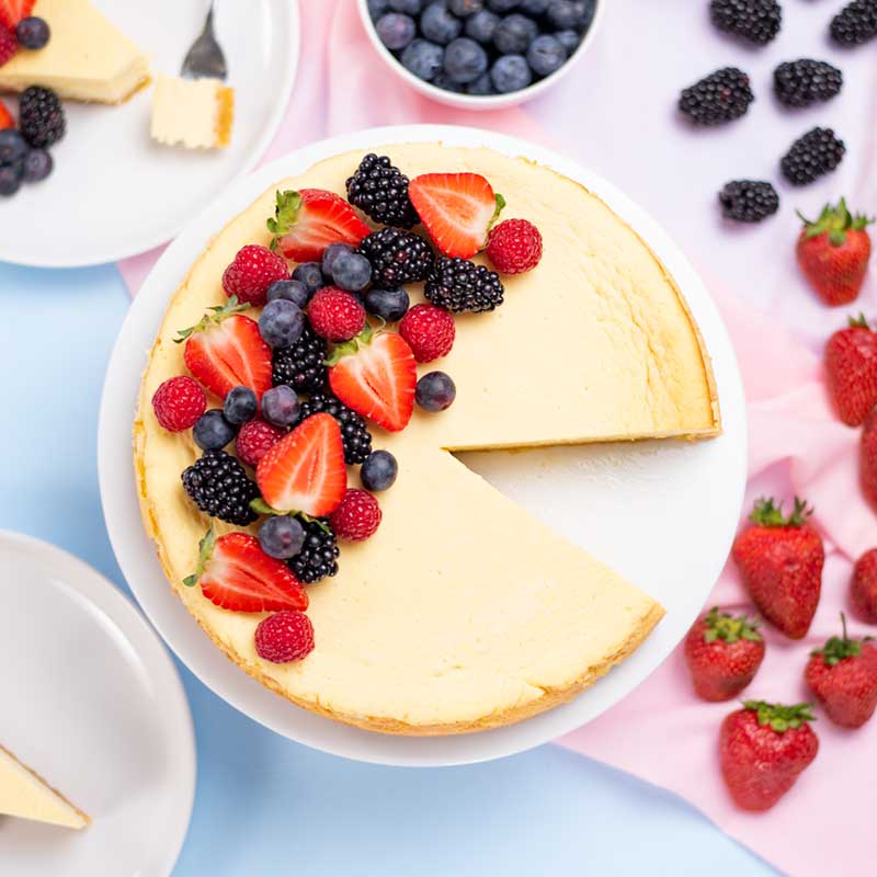 Keto Vanilla Cheesecake topped with berries.