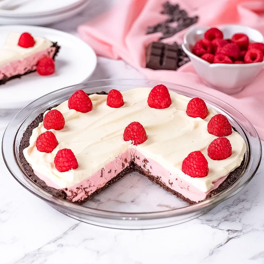 Keto raspberry cream pie in a pie dish.