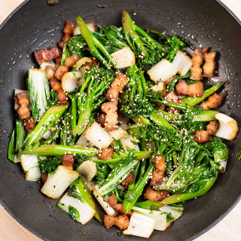 Keto Pork Belly Stir Fry in black wok.