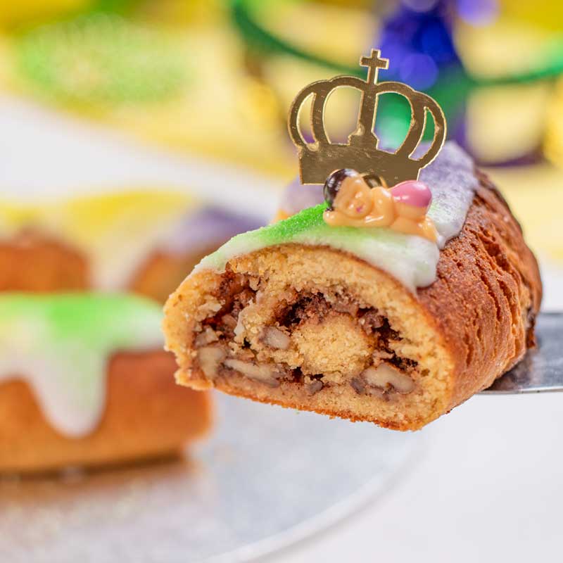 A slice of Keto King Cake showing the center cinnamon pecan swirl.