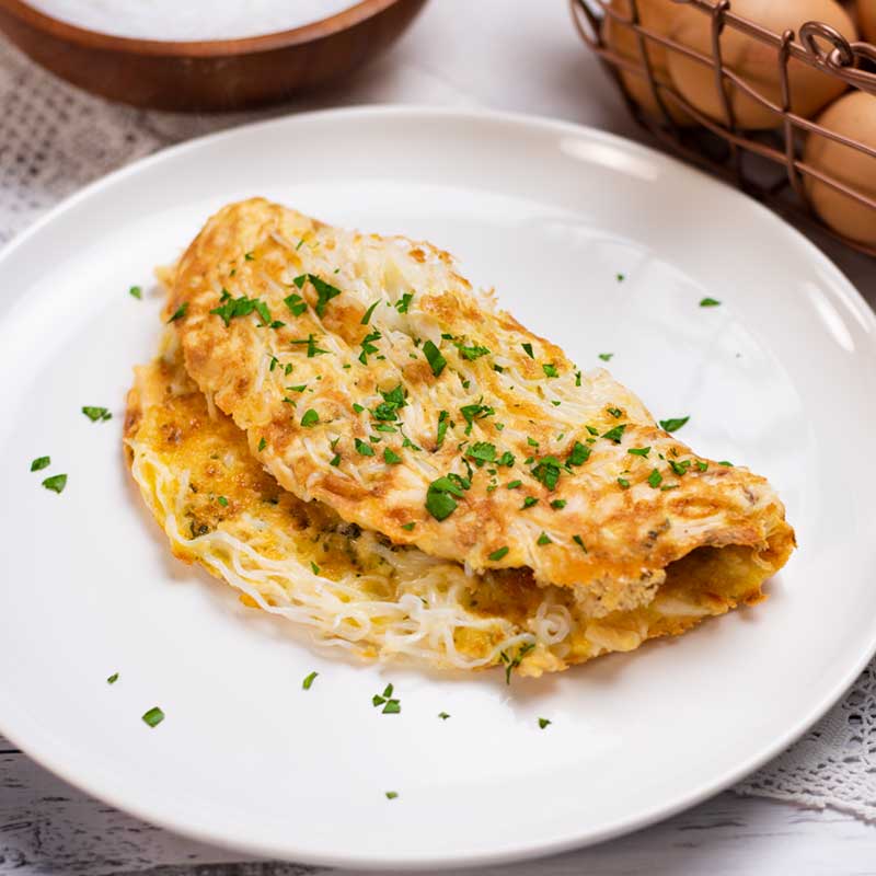 Keto Chicken Noodle Omelette on a white plate.