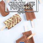 Keto Chocolate Popsicles on a blue table.