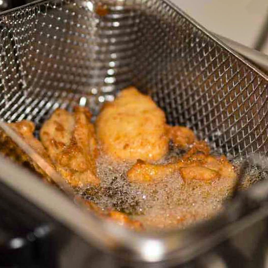 Fried chicken in the deep fryer.