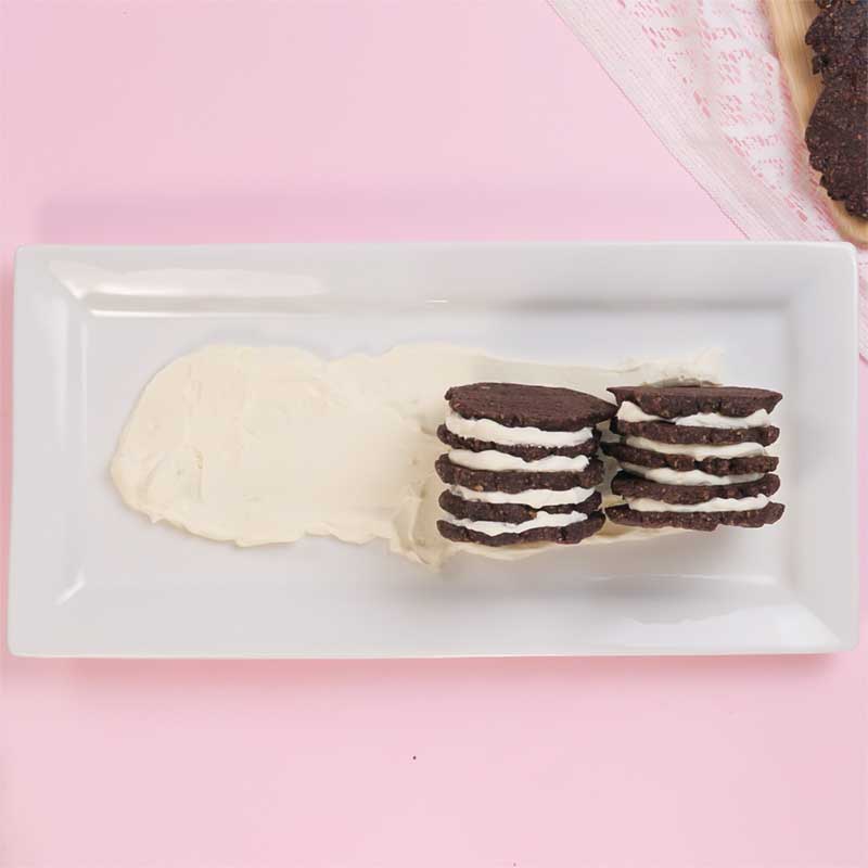 Keto Chocolate Ripple Cake cookie stacks being lined up on a serving platter.