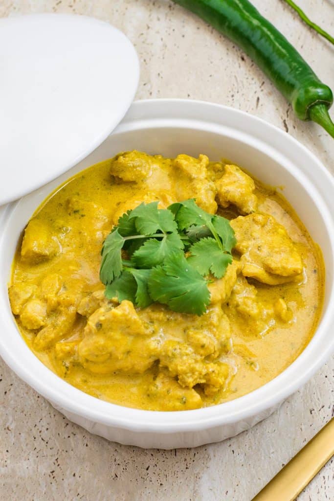 keto chicken curry in a white bowl.