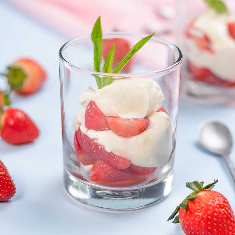 Low Carb Strawberries Romanoff served in glasses.