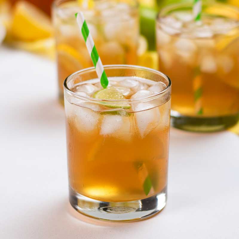 Sugar-Free Iced Tea in glasses with striped paper straws.