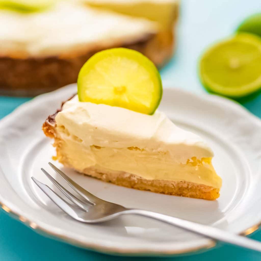 Slice of keto key lime pie on a plate.