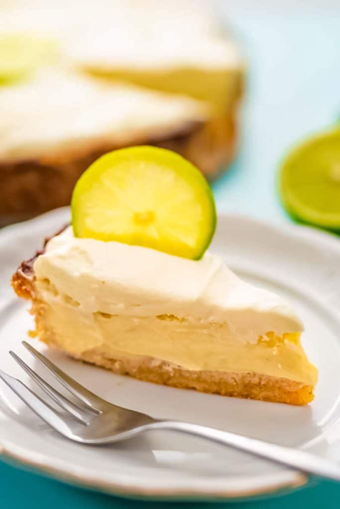 Slice of keto key lime pie on a plate.