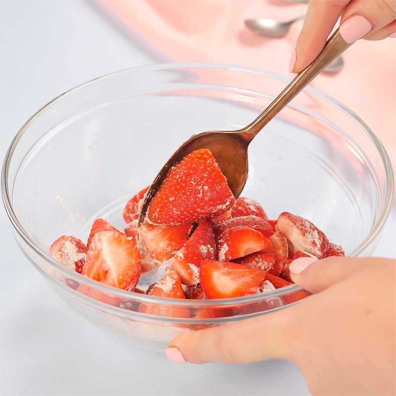 Low Carb Strawberries Romanoff Ingredients being mixed in a bowl.