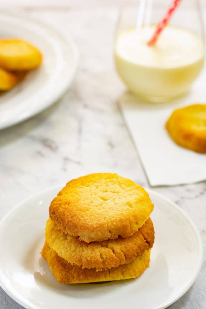 Three keto shortbread cookies stacked on top of one another.