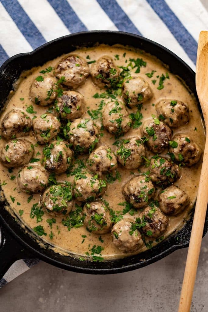 Keto Swedish meatballs in a cast iron skillet.