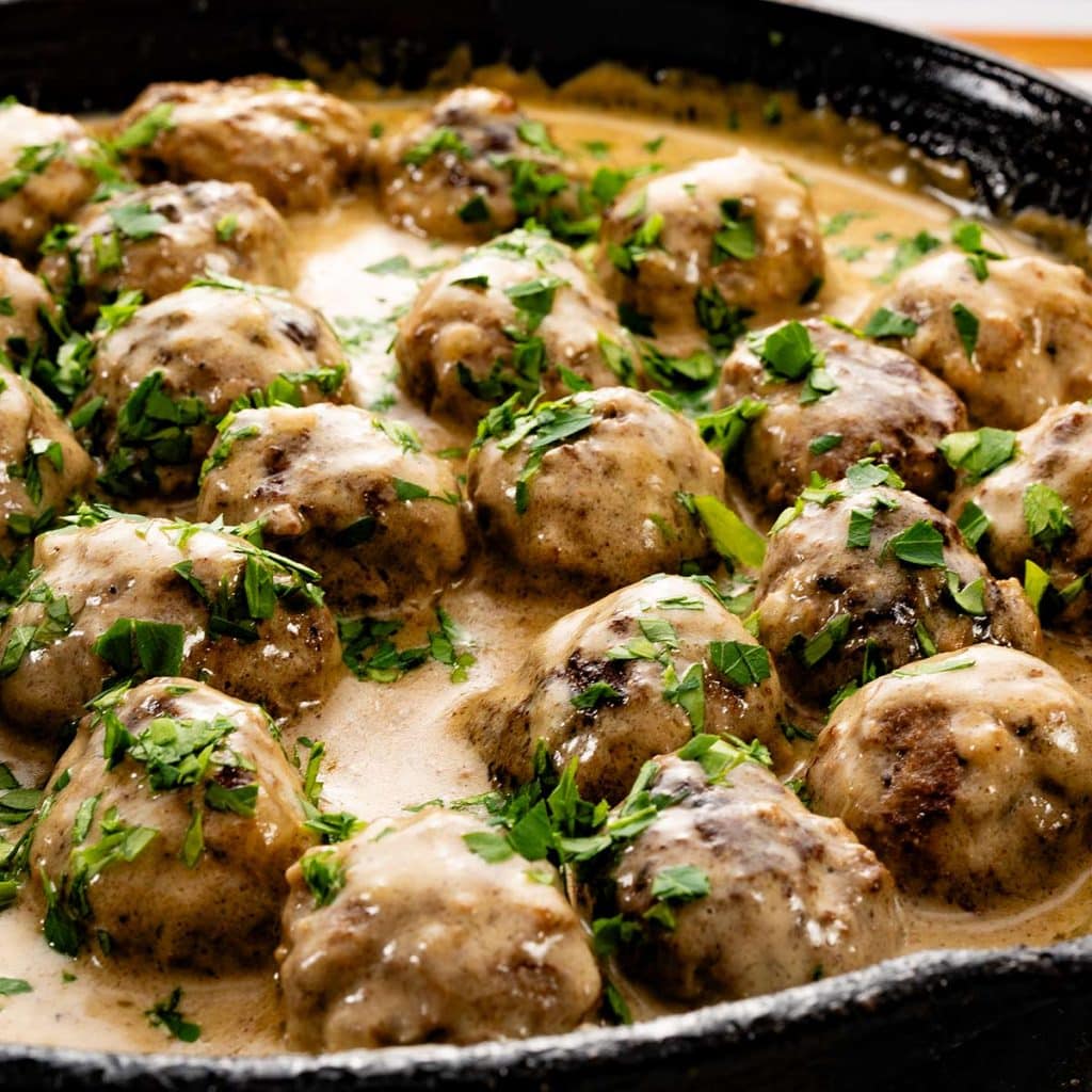 Keto Swedish meatballs in a cast iron skillet.