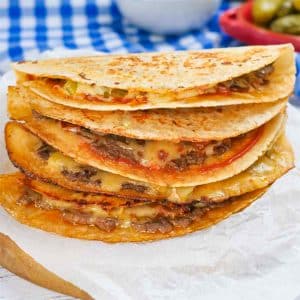 Four keto quesadillas stacked on top of each other.