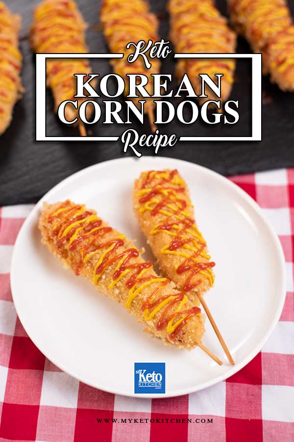 Keto Cheesy Corn Dogs on a plate, covered in mustard and ketchup.