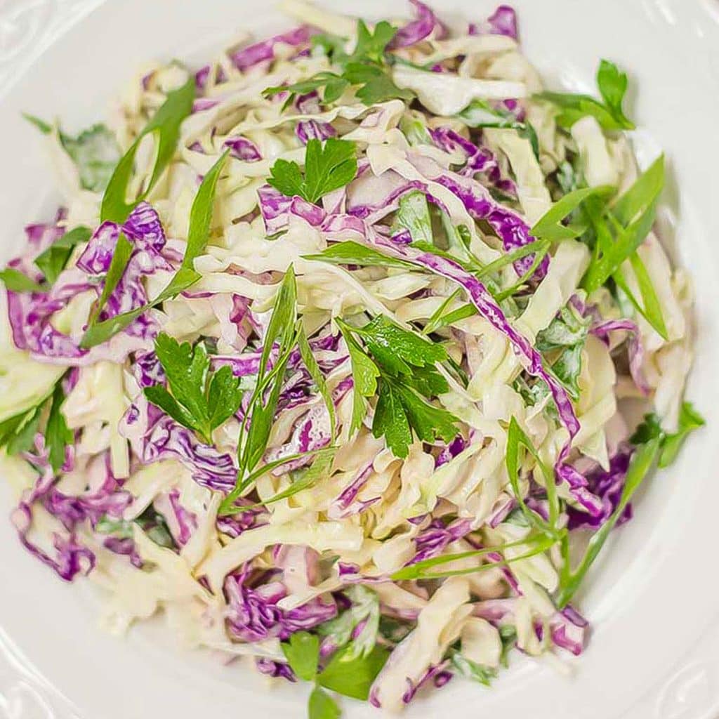 Keto coleslaw in a white bowl.