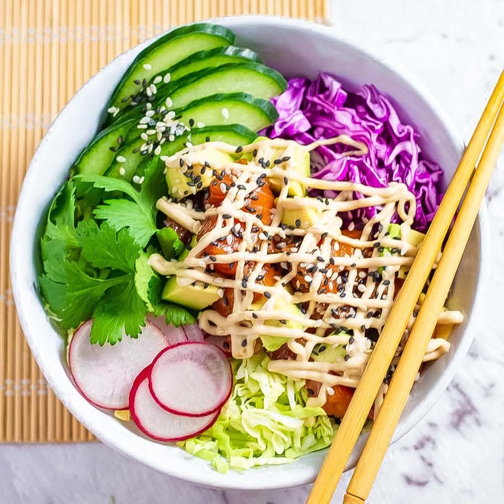 Keto poke bowl with chopsticks in a white bowl.