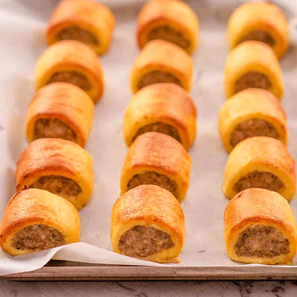 Keto sausage rolls on a sheet pan.