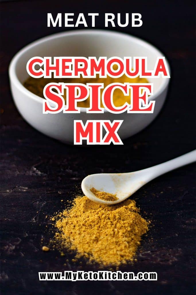 Chermoula spice mix on a table with a teaspoon.