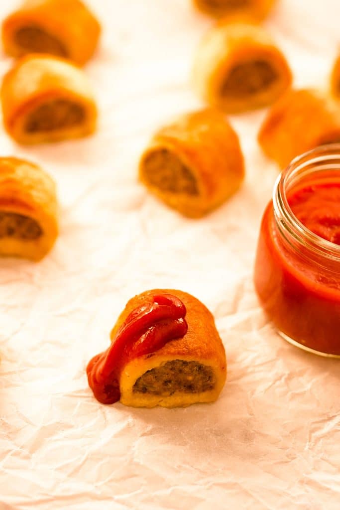 Keto sausage rolls on a sheet pan.