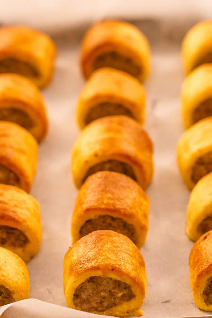 Keto sausage rolls on a sheet pan.