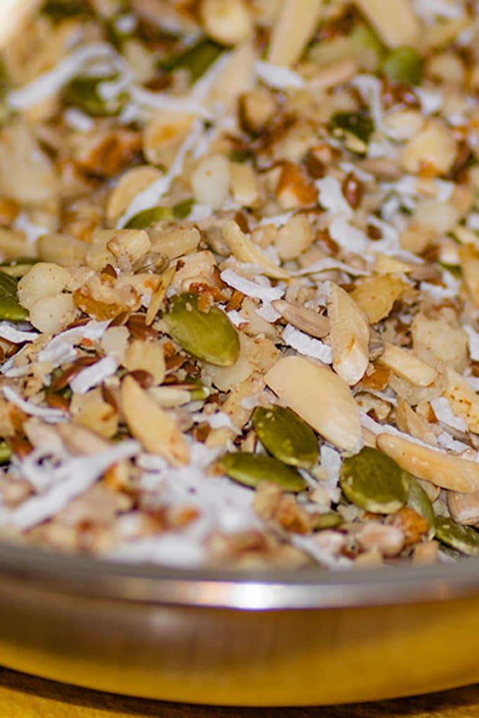 Keto granola bar ingredients in a mixing bowl.