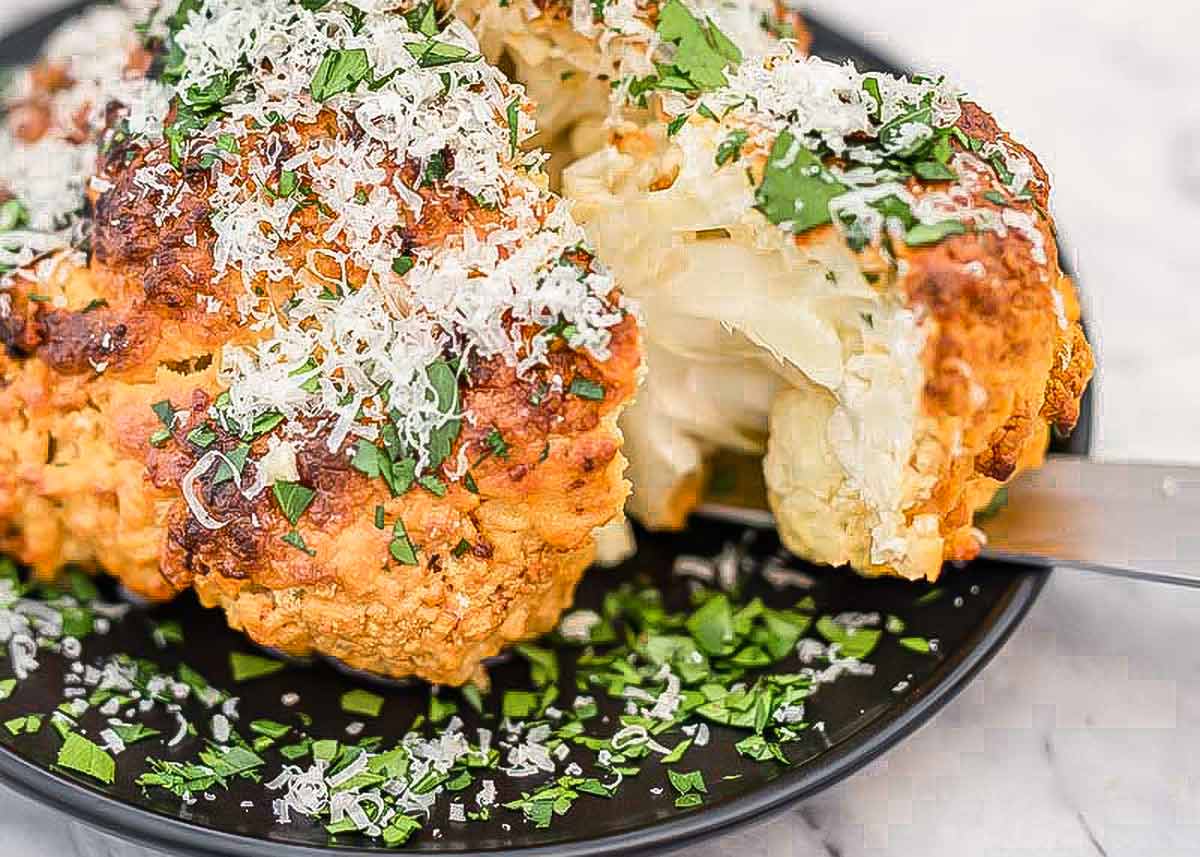 Whole Roasted Cauliflower Baked with Garlic and Cheese
