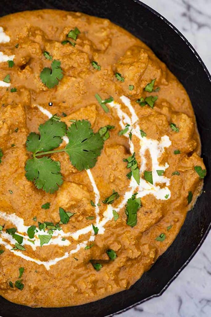 keto butter chicken in a cast iron pan.