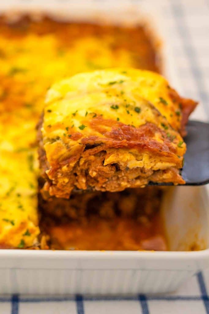 Slice of keto lasagna on a spatula.