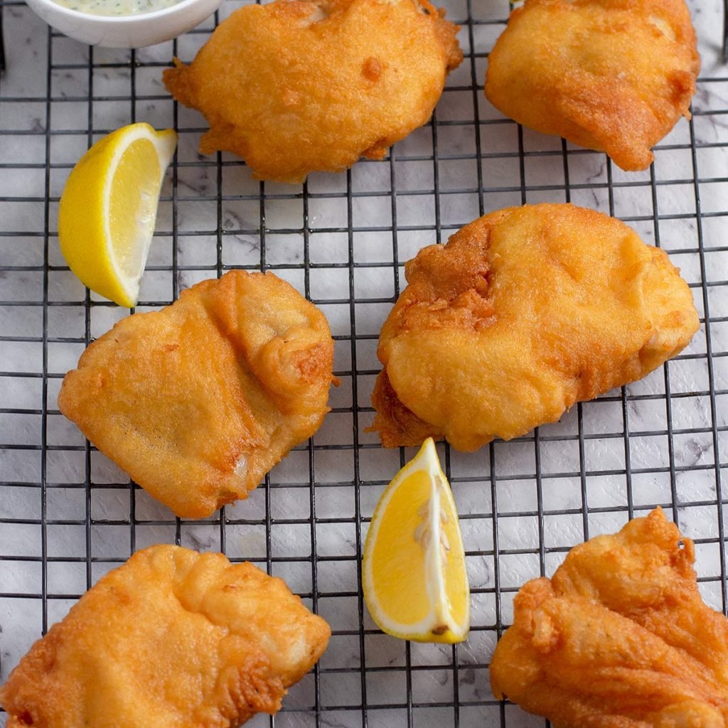 Keto battered fish on a rack.