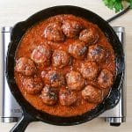 Keto ground beef in a frying pan made into meatballs.