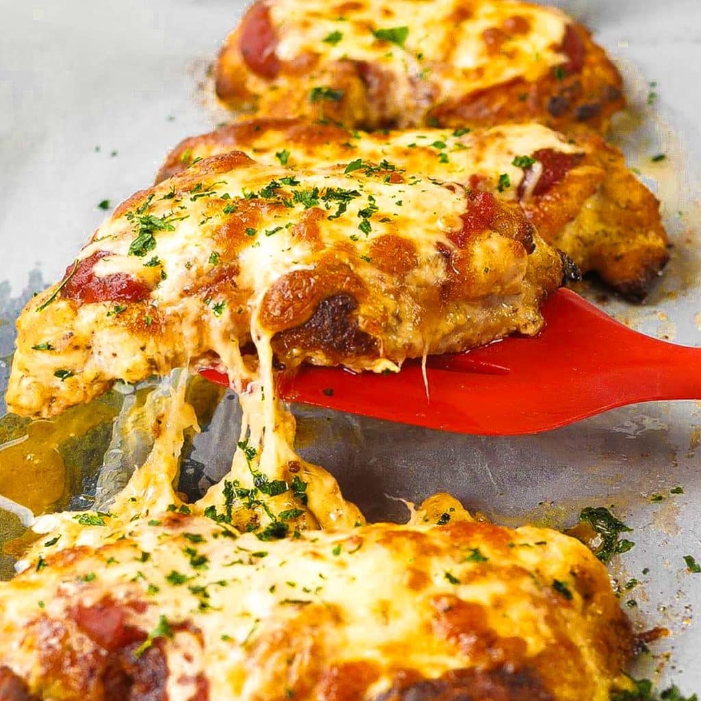 Keto chicken parmesan on a baking tray.