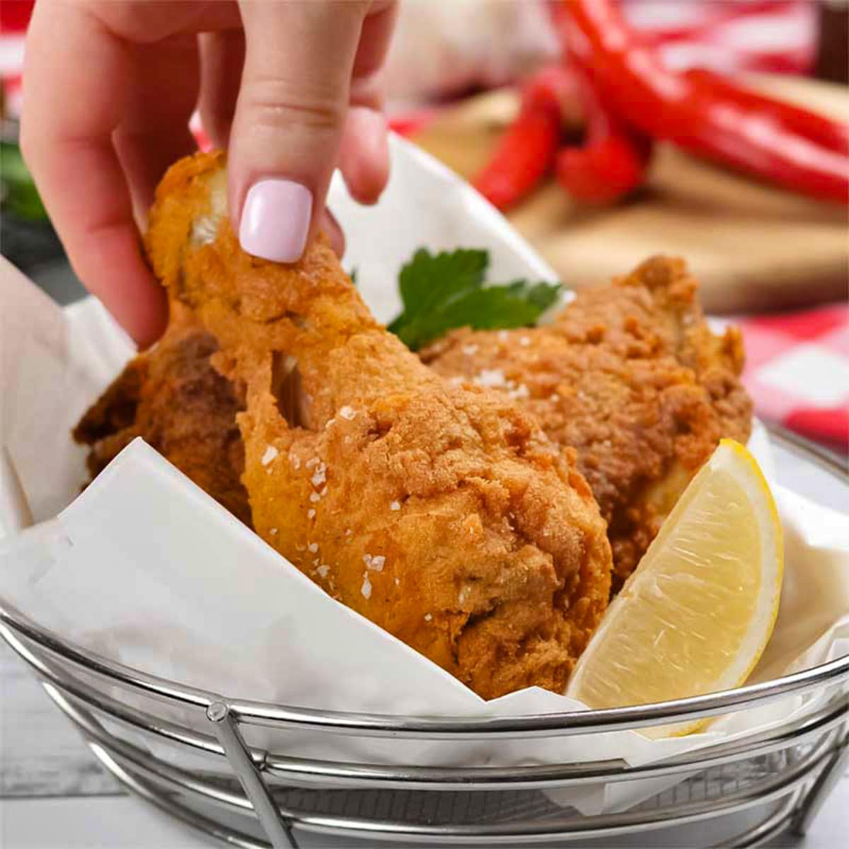 Keto hot and spicy fried chicken in a basket.