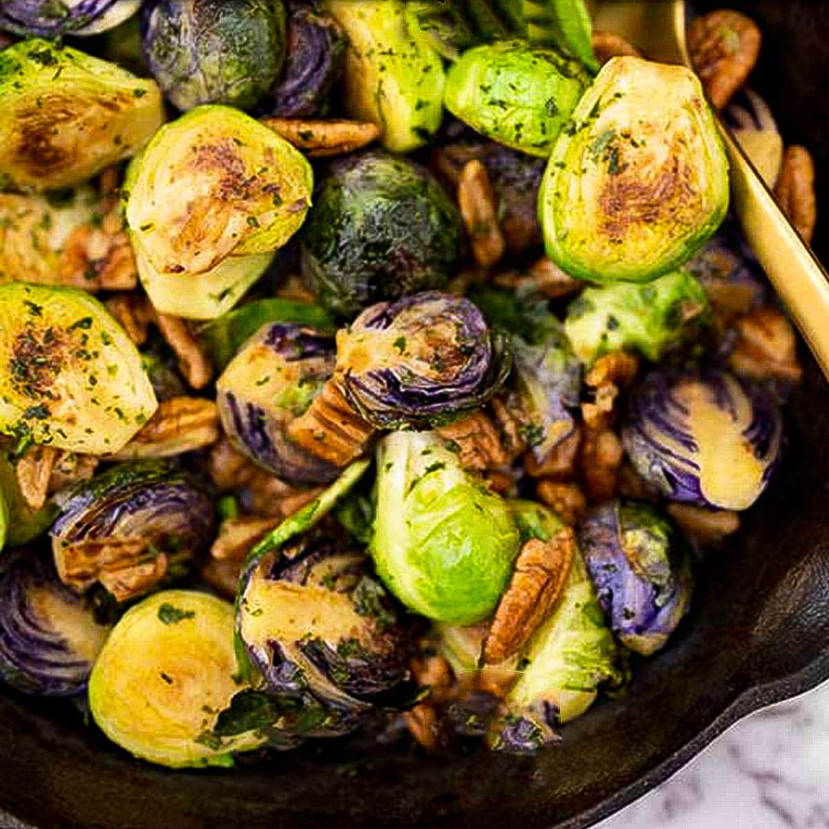 Keto brussel sprouts in a cast iron pan.