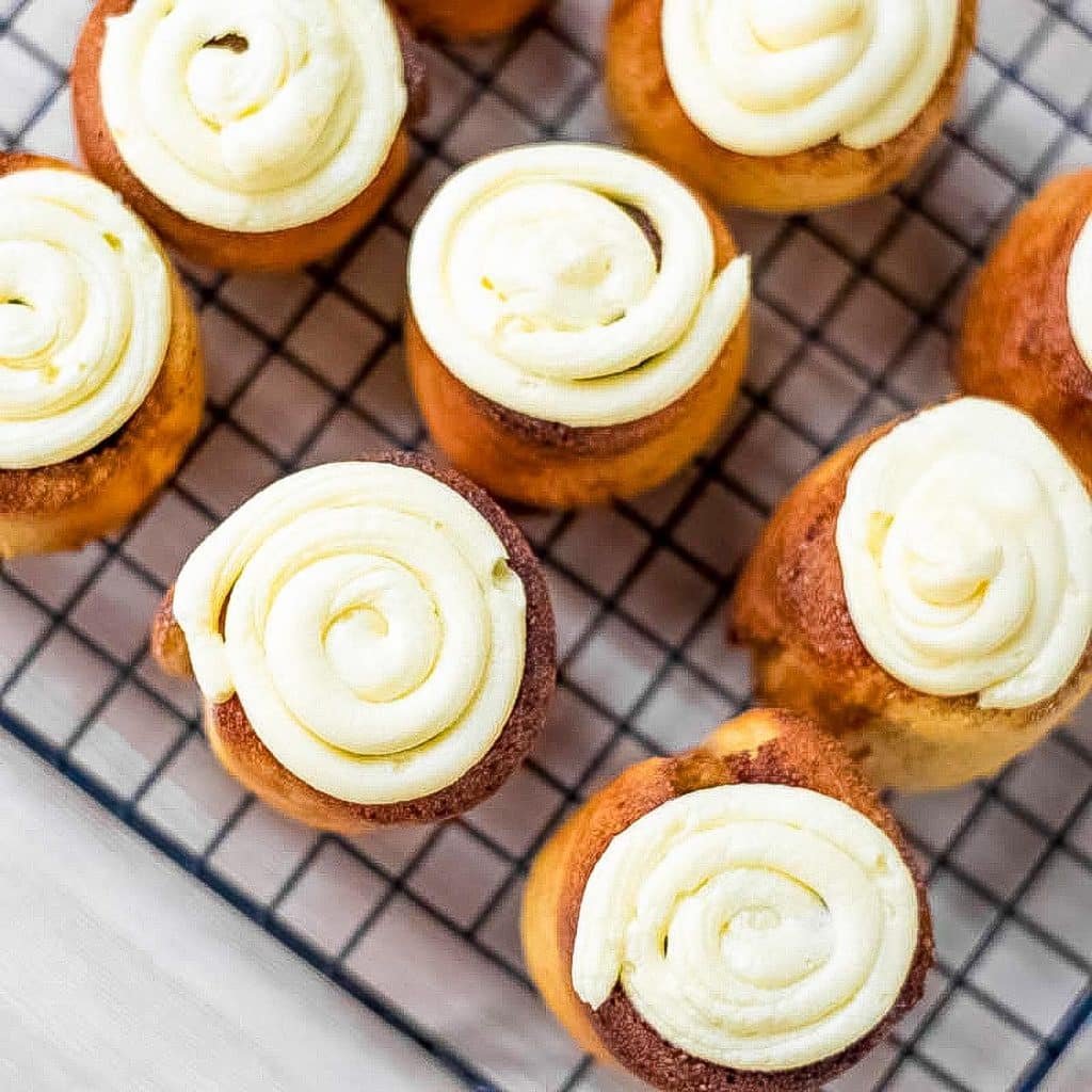 Keto cinnamon rolls on a cooling rack.